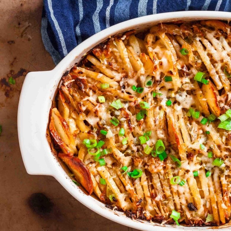 Overhead shot of hasselback potatoes in a casserole dish.