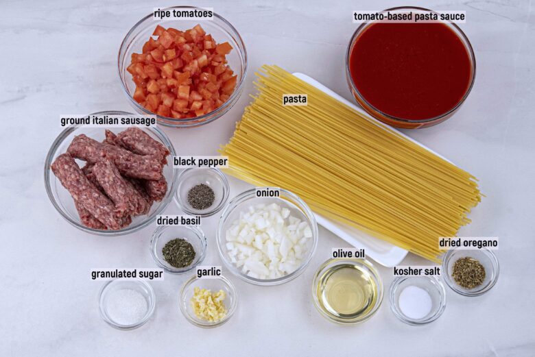 Overhead shot of ingredients to make Italian sausage pasta.