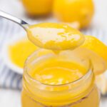 lemon curd homemade in a jar and spoonful.