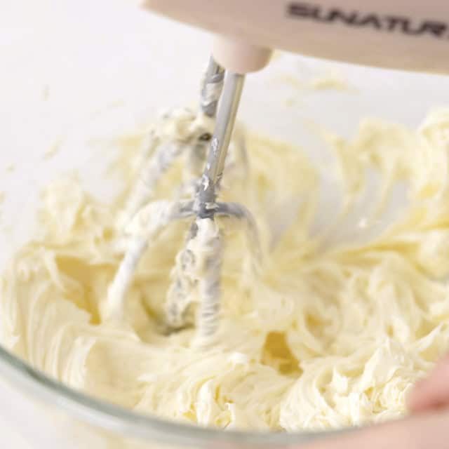 Butter being creamed in a bowl to make levain chocolate chip cookies.
