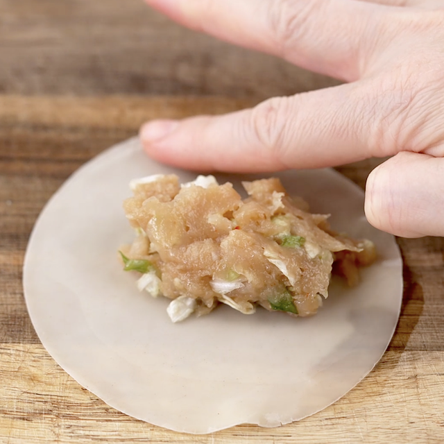 Potsticker wrapper being moisten on the edges.