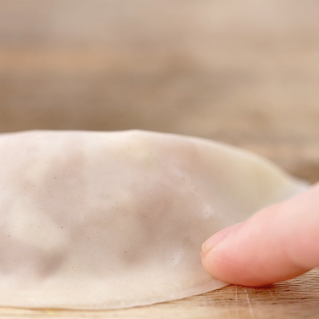 Edges being sealed to make potstickers.
