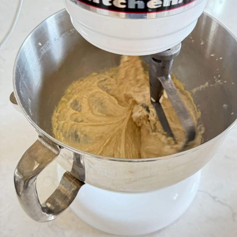Sugars creamed to make coconut chocolate chip cookies.