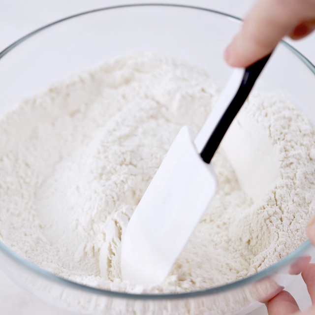 Dry ingredients to make peanut butter sandwich cookies being mixed.