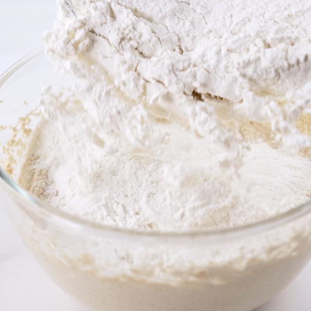 Dry ingredients being mixed into wet ingredients.