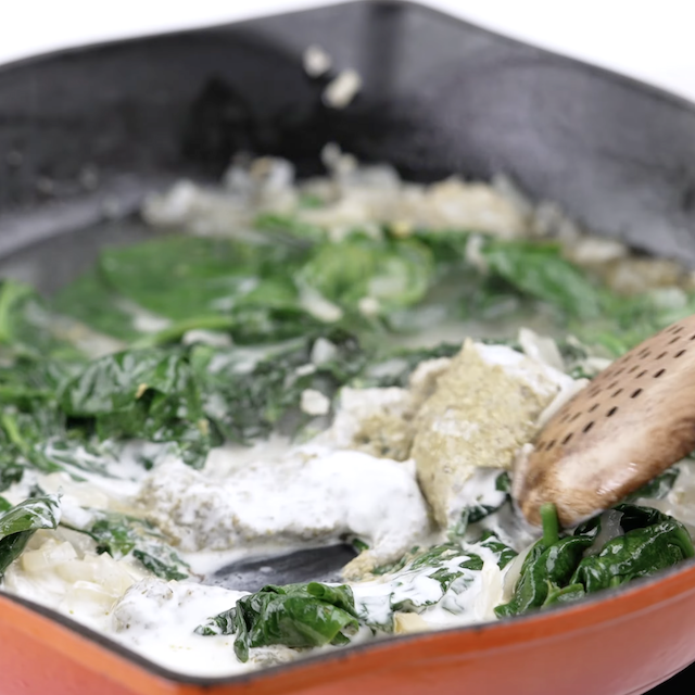 Pesto added to spinach mix to make chicken florentine pasta.