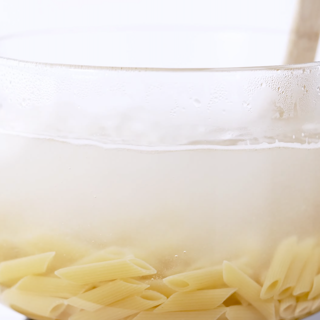 Pasta being boiled to make chicken florentine pasta.