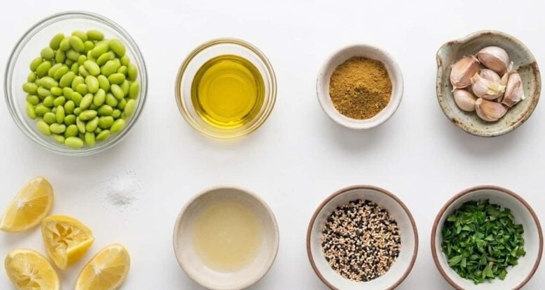 Edamame Hummus ingredients such as olive oil, tahini, and edamame beans and garlic.