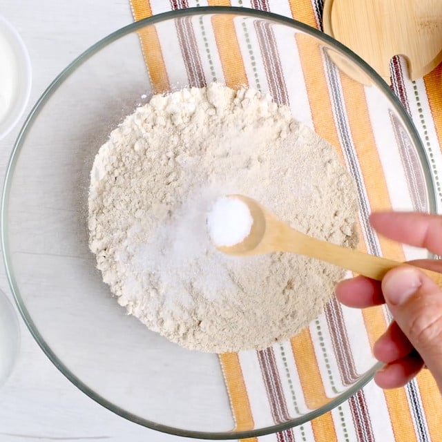 Dry ingredients to make garlic naan being mixed.