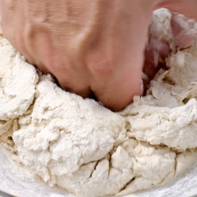Garlic naan dough being kneaded.