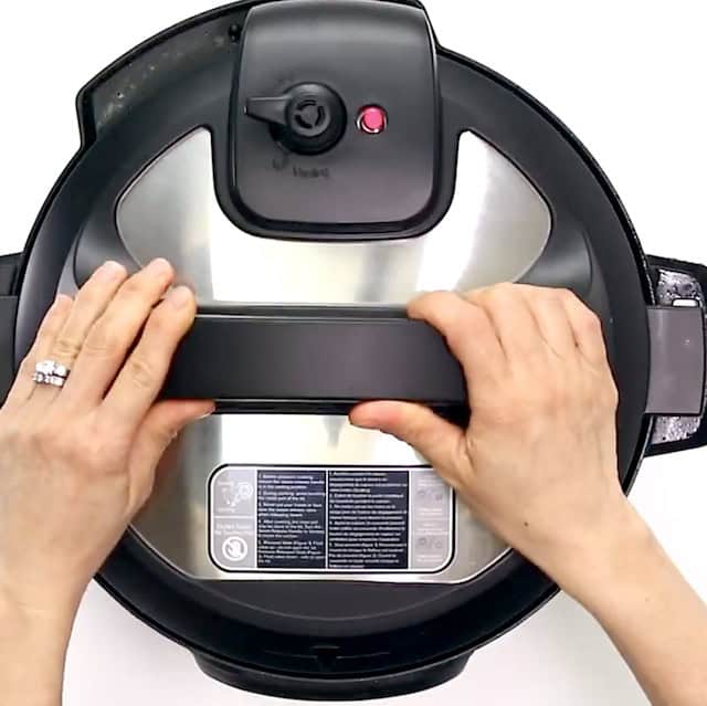 Lid being pot on instant pot.