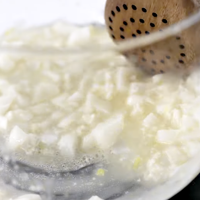 Aromatics being sauteed in butter.