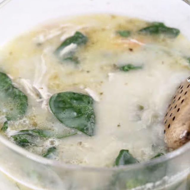 Lemon chicken soup cooking in a pot.