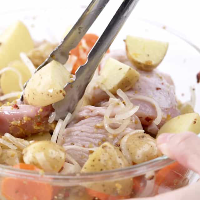 Sheet pan chicken potatoes in a bowl.