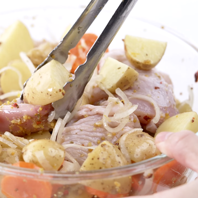 Sheet pan chicken potatoes in a bowl.