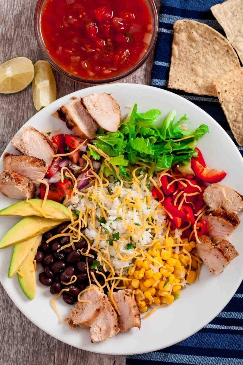 Overhead shot of chipotle chicken burrito bowls, ready to be served.