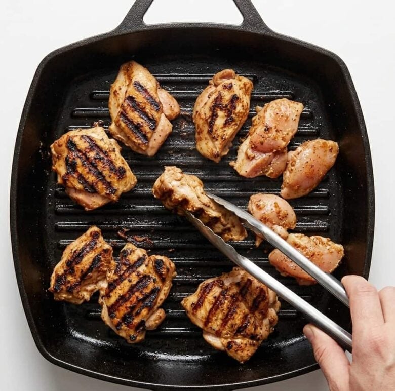 Chicken being grilled to make chipotle chicken burrito bowls at home.