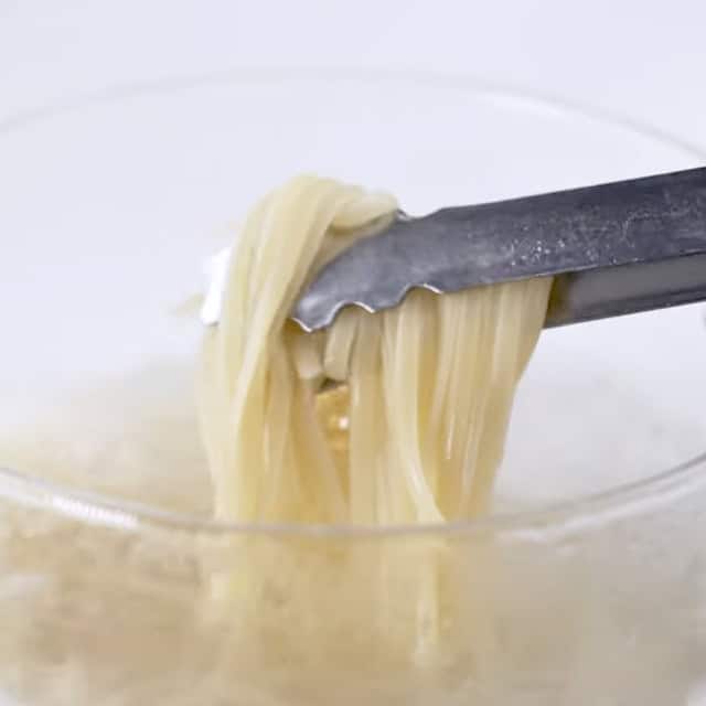 Pasta being boiled to make lemon chicken pasta.