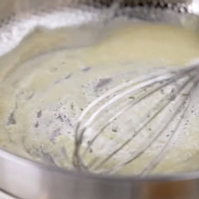 Lemon chicken pasta sauce being made in a pan.