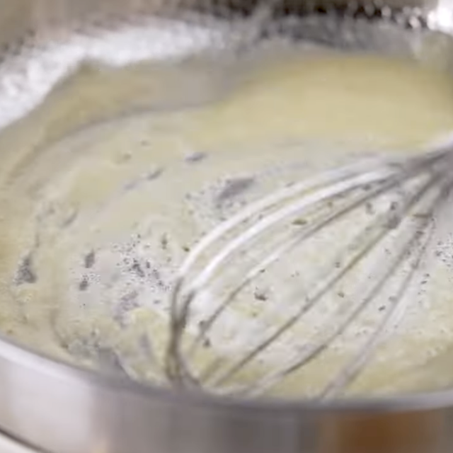 Lemon chicken pasta sauce being made in a pan.