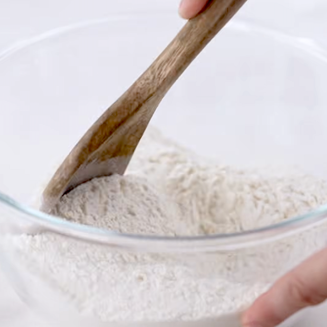 Dry ingredients being mixed to make fluffy buttermilk pancakes.