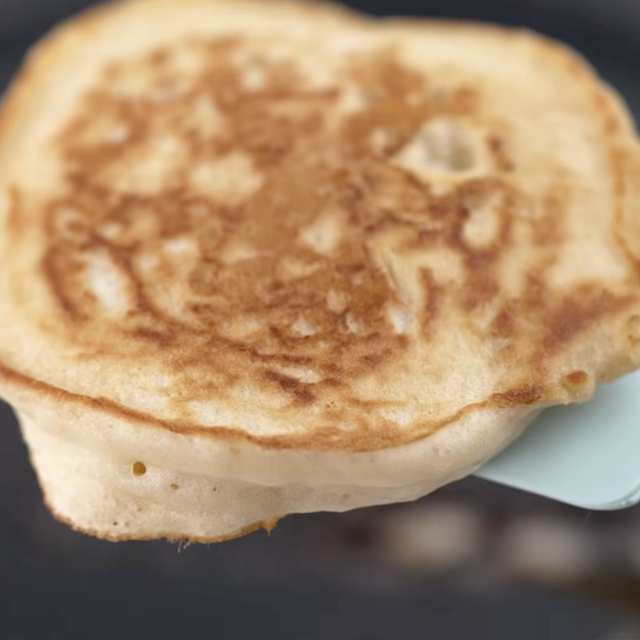 Freshly made fluffy buttermilk pancake on a spatula.