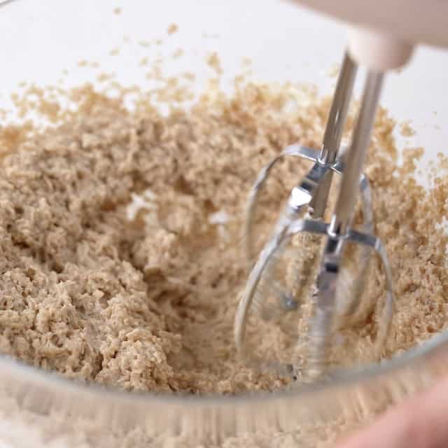 Butter and sugars being beaten together to make smores bars recipe.