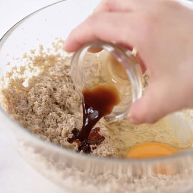 Vanilla being added to bowl with butter sugar mix.