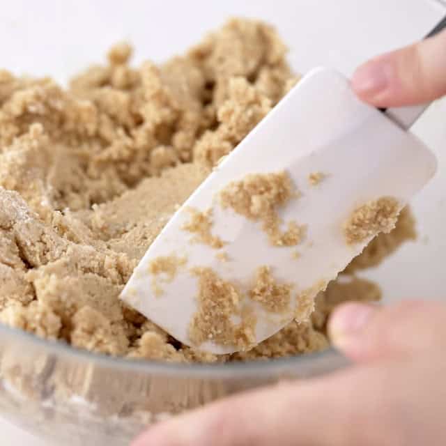 Smores bars batter being mixed with a rubber spatula.