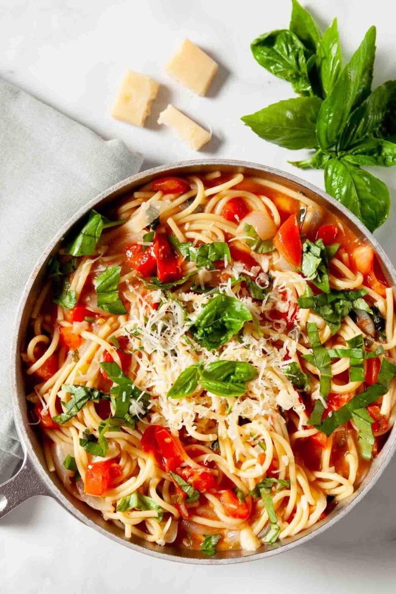 Round bowl full of one pot pasta on the table.