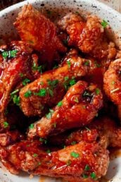 White bowl full of buffalo chicken wings.