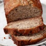 Banana bread slices on a white plate.
