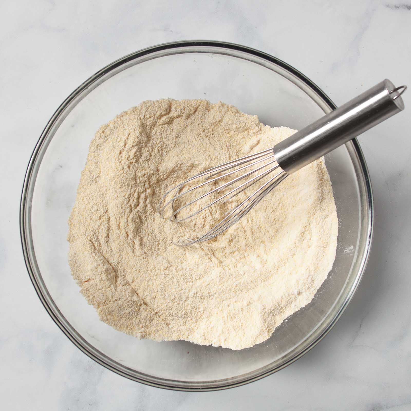 Using a whisk to combine the dry ingredients.