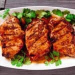 Serving plate with Honey Mustard Pork Chops on it.