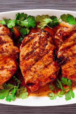 Serving plate with Honey Mustard Pork Chops on it.