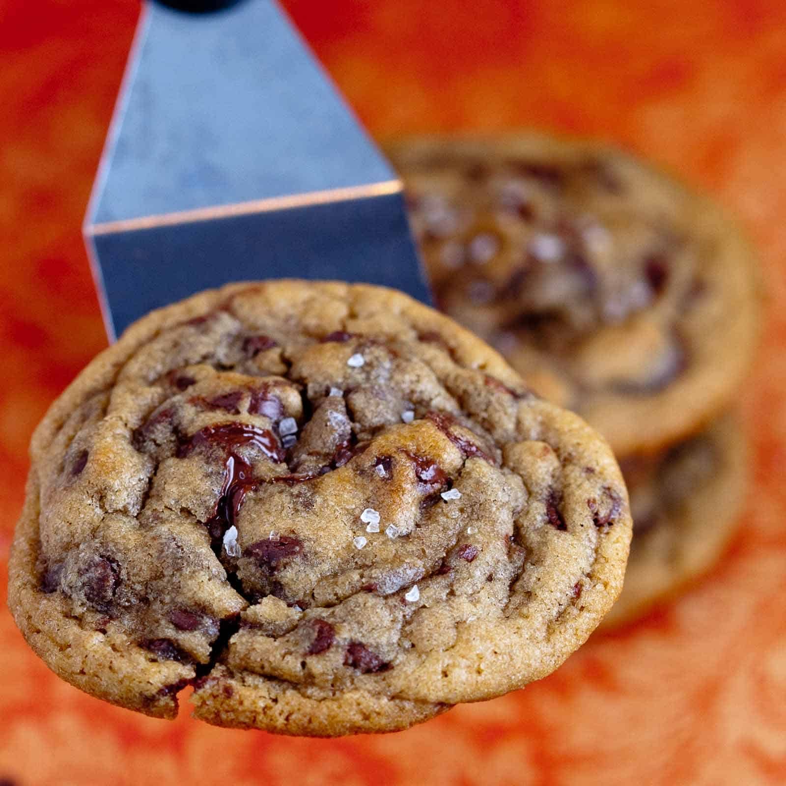 Spatula holding up one of the No Chill Chocolate Chip Cookies.