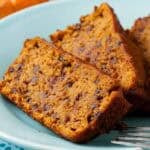 Slices of Vegan Pumpkin Bread on a ight blue plate.