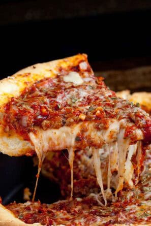 A slice of deep dish pizza.