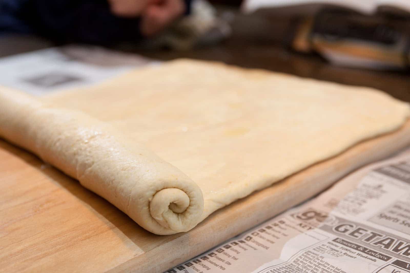 Rolling out the deep dish pizza dough.