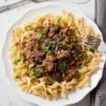White plate full of slow cooker beef stroganoff.