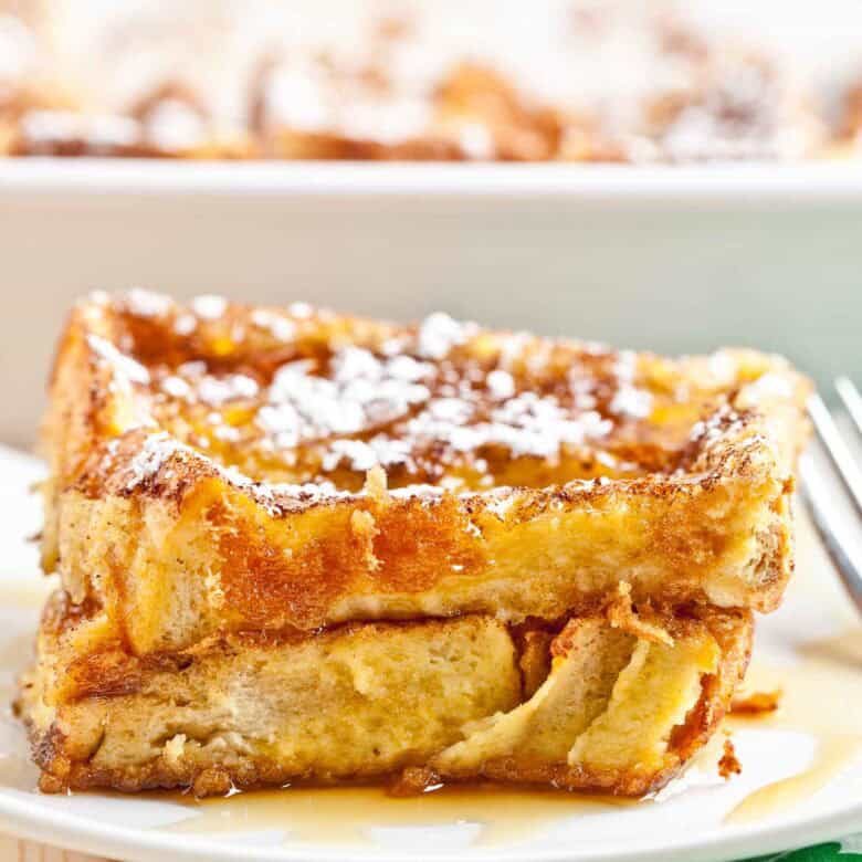 French toast bake using Texas Toast white sliced sandwich bread, sliced and sprinkled with powdered sugar on top.