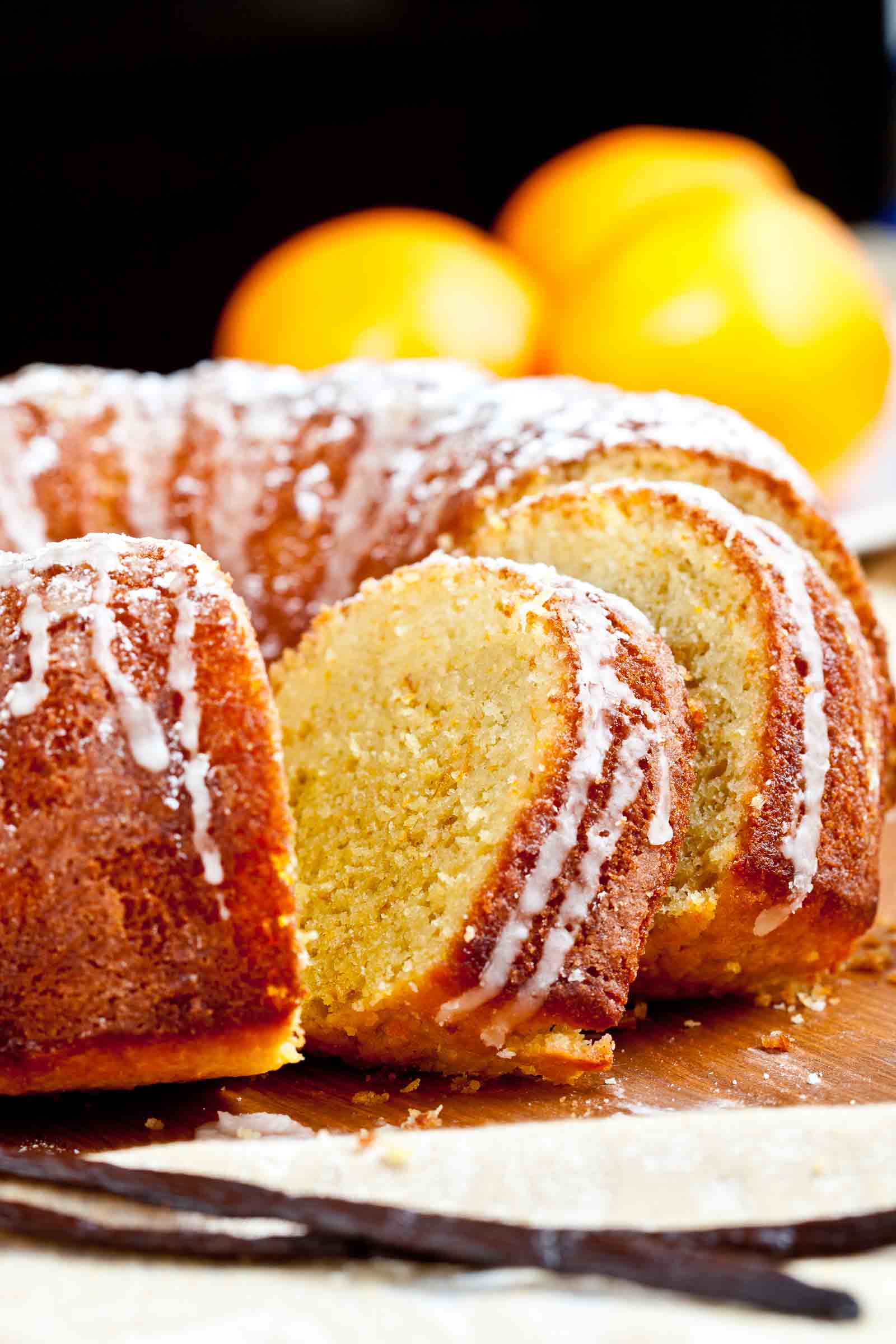 Sliced Orange Bundt Cake with a drizzle on top.