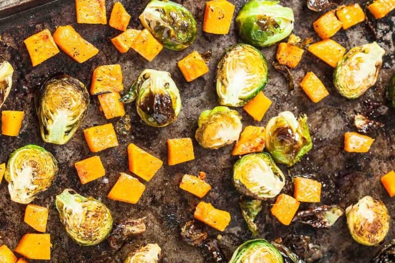 Roasted Brussels Sprouts and Butternut Squash on a baking sheet.